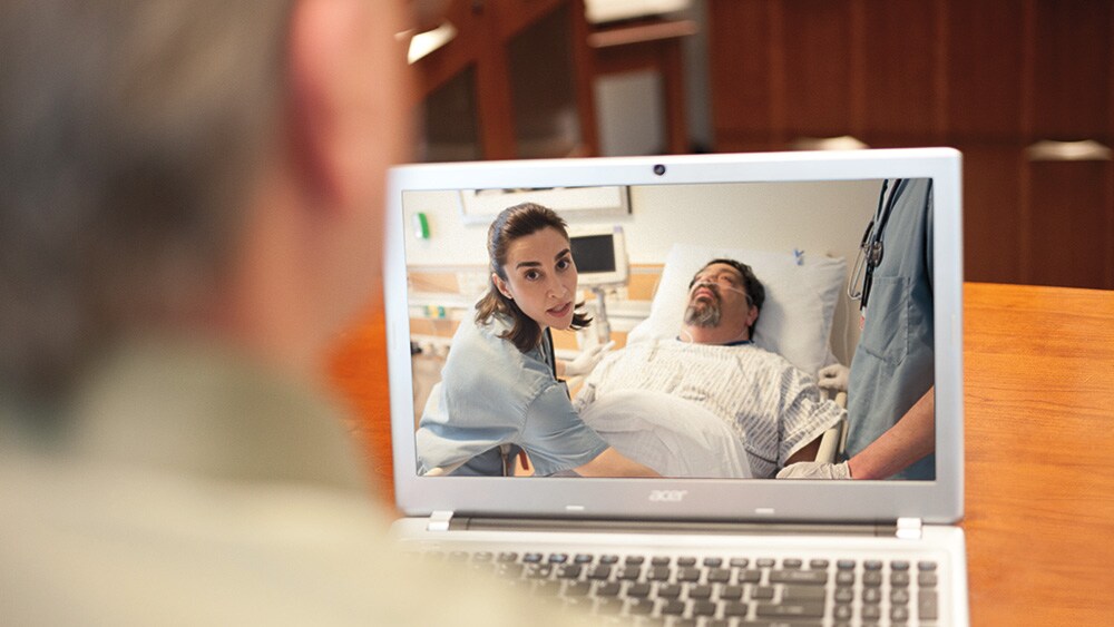 A remote clinician providing guidance to a nurse