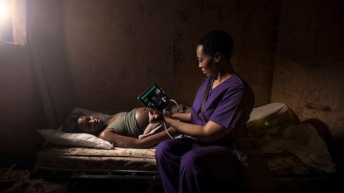 midwife performing ultrasound scan